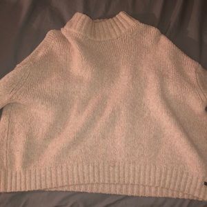 A light pink sweater